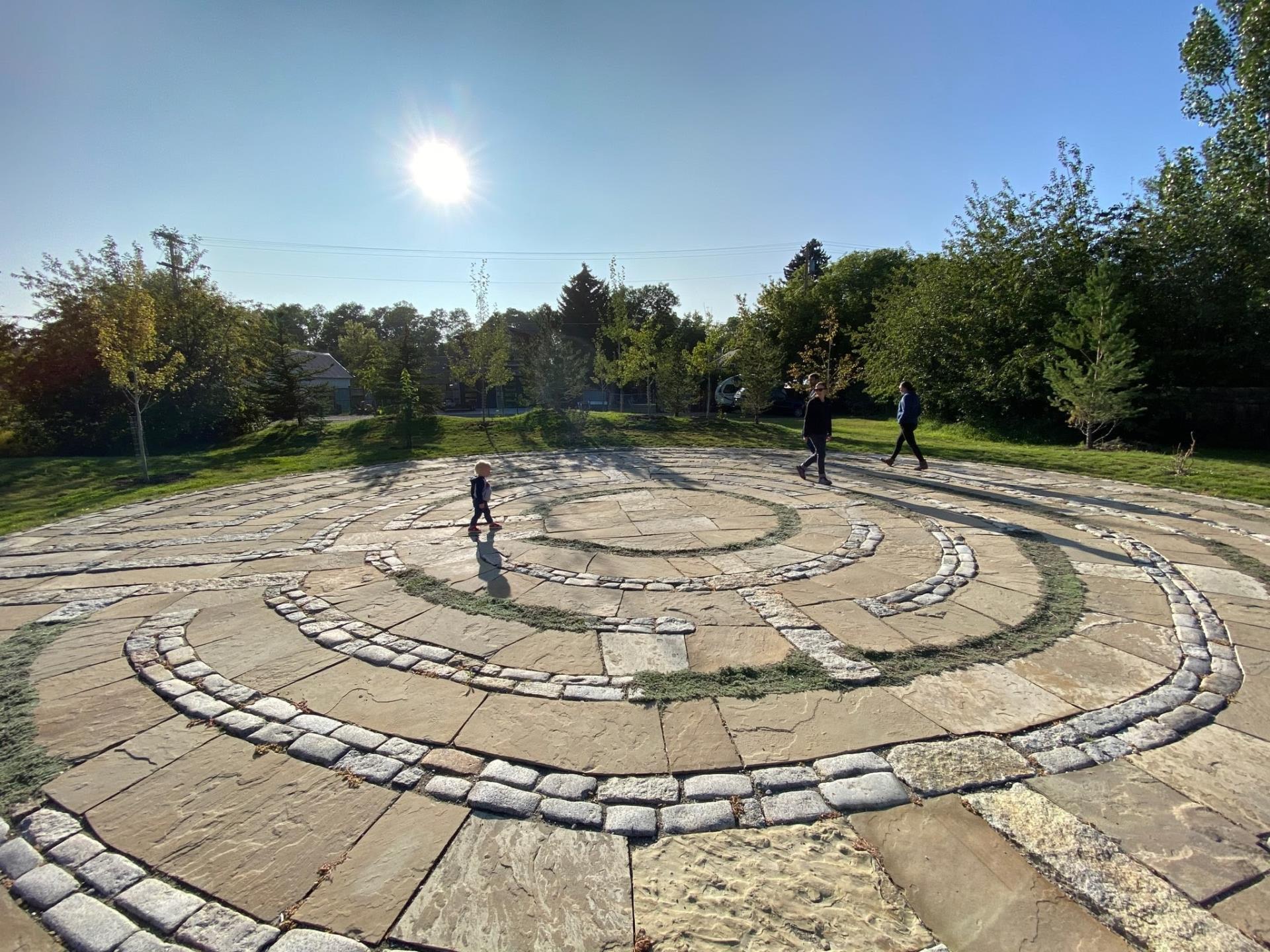 children walking on the stone labyrinth