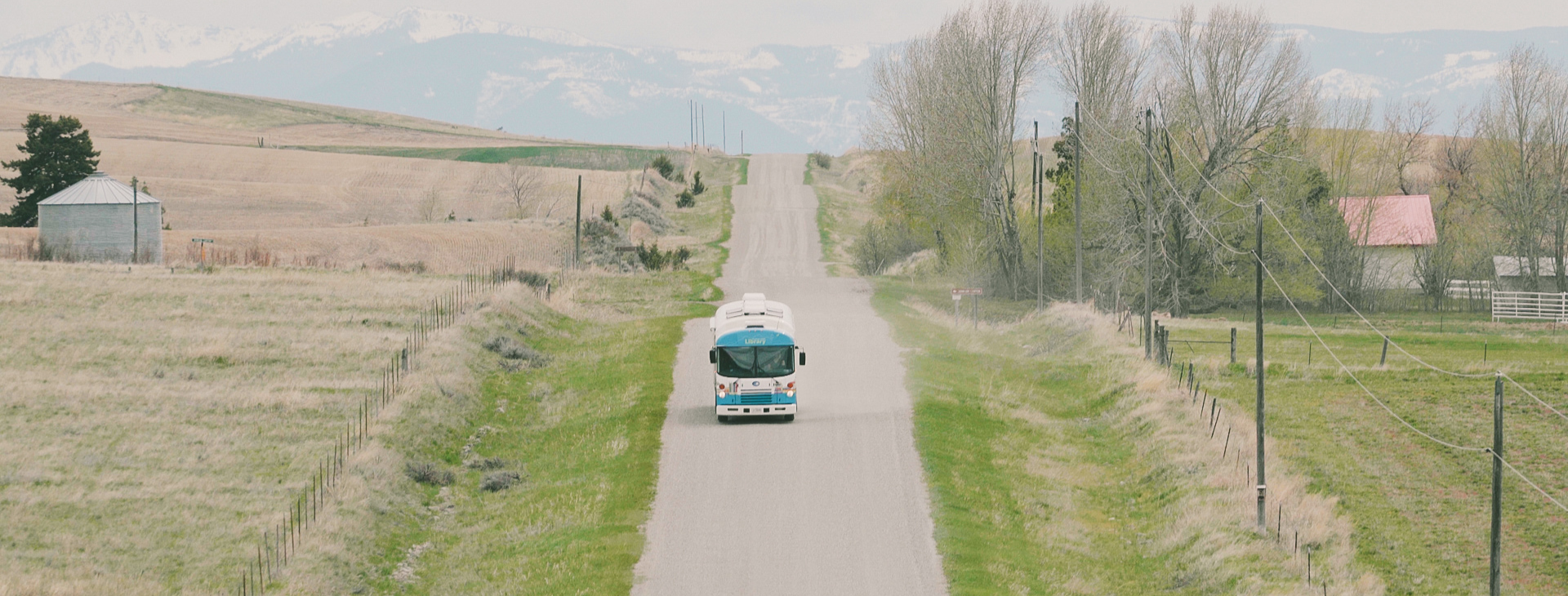 A photo of the bookmobile driving down a long road