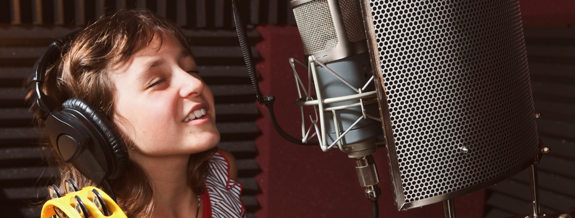 child talking into microphone